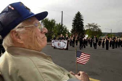 
Hugh Cravens, 92, watches as the West Valley High School marching band performs for him Saturday evening at the school. Hugh Cravens, 92, watches as the West Valley High School marching band performs for him Saturday evening at the school. 
 (Dan Pelle/Dan Pelle/ / The Spokesman-Review)