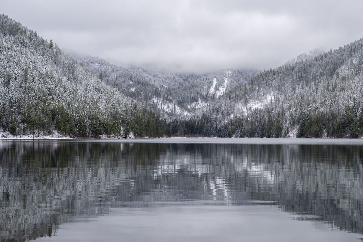 Marshall Lake, north of Newport, Wash., and the surrounding mountains is dusted with snow.  (ANGELA SCHNEIDER/The Spokesman-Review)