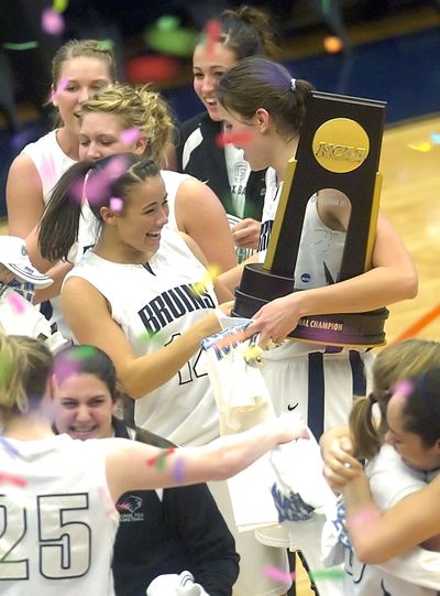 George Fox players celebrate an undefeated season and the NCAA Division III women’s title on Saturday in Salina, Kan.  (Associated Press / The Spokesman-Review)