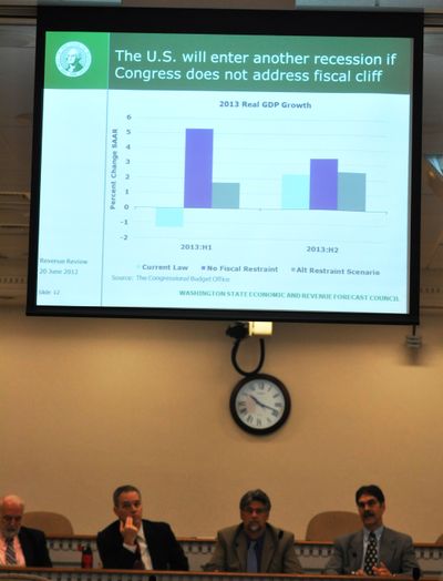 OLYMPIA -- Members of the state Economic and Revenue Forecast Council, get the budget outlook for the next three years from Economist Steve Lerch. From left, Marty Brown, director of the Office of Financial Management, Rep. Ross Hunter, D-Medina, Rep. Ed Orcutt, R-Kalama, and Lerch. (Jim Camden)
