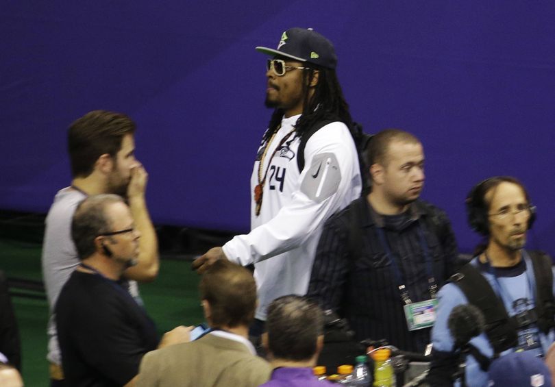 Seattle’s Marshawn Lynch leaves media day after five minutes. (Associated Press)