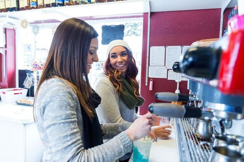 Marisa Randock, right, and Lexi Blum, co-owners of Bro Latte in Rathdrum, talk while making drinks for a customer Wednesday.