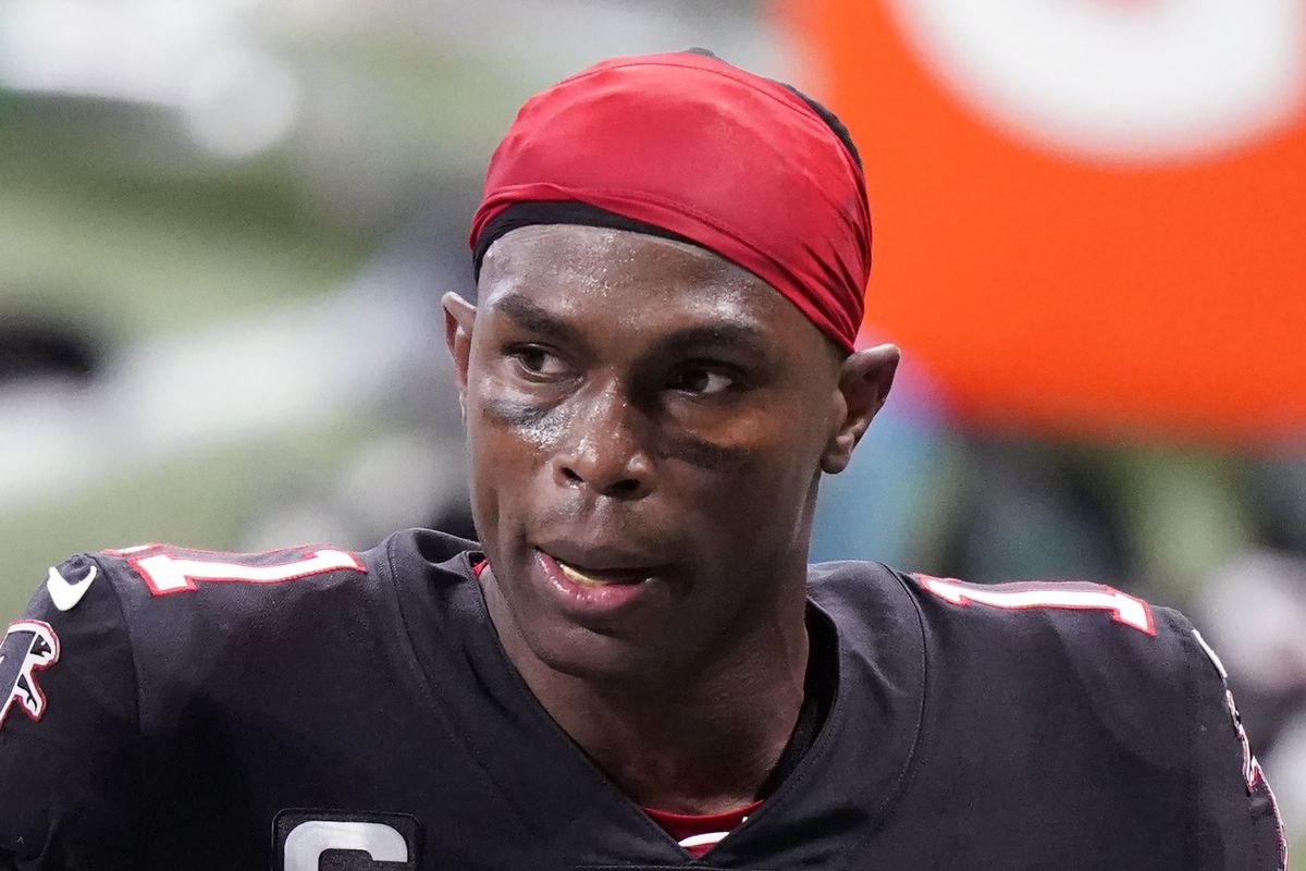 Atlanta Falcons wide receiver Julio Jones (11) leaves the field during the first half of an NFL football game against the New Orleans Saints in Atlanta, in this Sunday, Dec. 6, 2020, file photo. The Tennessee Titans have traded with the Atlanta Falcons for seven-time Pro Bowl wide receiver Julio Jones, a person familiar with the situation told The Associated Press. (Brynn Anderson)