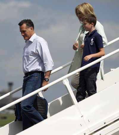 Republican presidential candidate, former Massachusetts Gov. Mitt Romney, his wife Ann, and their grandson Joe, arrive at Tampa International Jet Center, Tuesday, Aug. 28, 2012, in Tampa, Fla. (Evan Vucci / Associated Press)