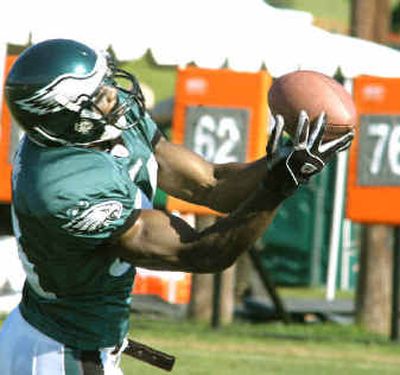 
Philadelphia receiver Terrell Owens may not make catches this easy against Baltimore's Ray Lewis. 
 (Associated Press / The Spokesman-Review)