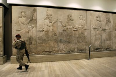 An Iraqi soldier stands guard in the restored National Museum in Baghdad on Monday.  (Associated Press / The Spokesman-Review)