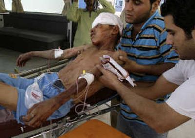 
A wounded boy arrives at a hospital in Sadr City on Saturday. Associated Press
 (Associated Press / The Spokesman-Review)