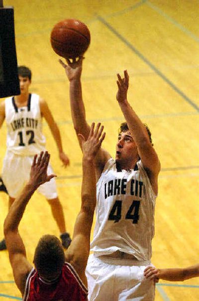 Lake City's Nick Fromm gets off a shot over a Madison defender.
(Jesse Tinsley / The Spokesman-Review)