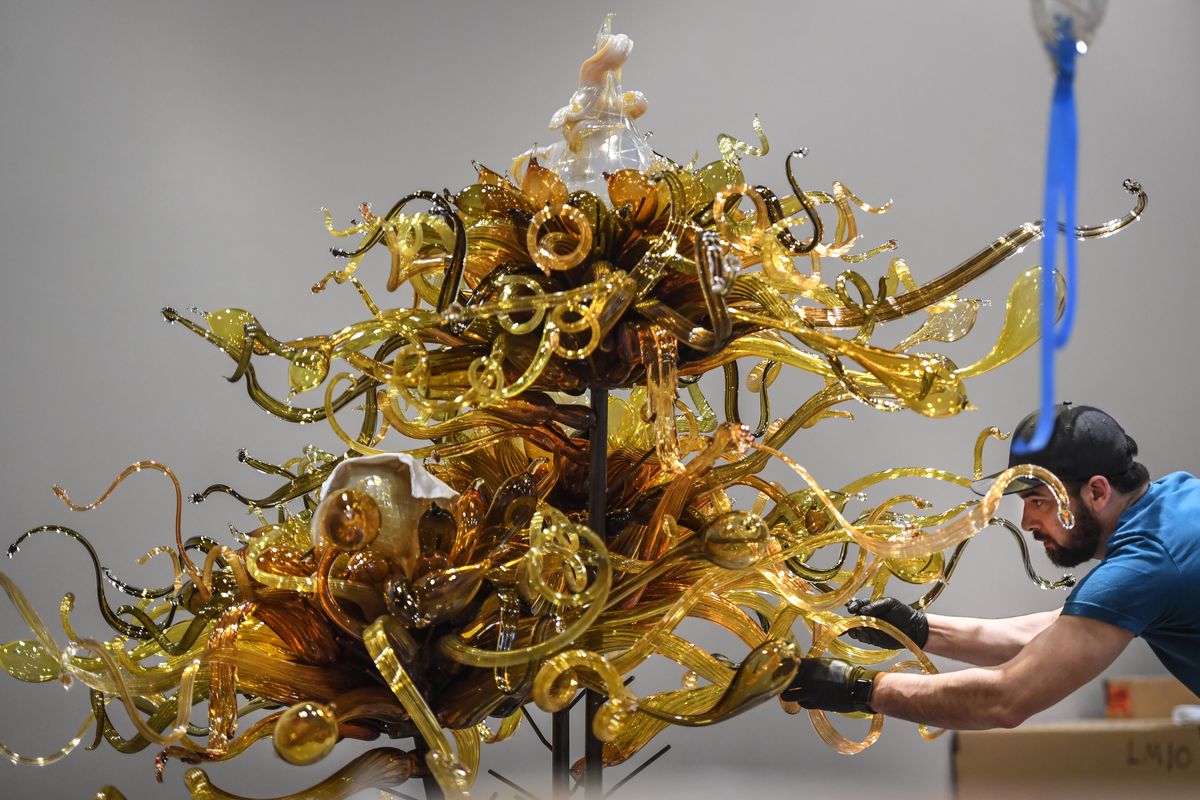 Mitchell Burdett assembles the Chihuly Laguna Murano Chandelier as part of the “Luminous: Dale Chihuly and The Studio Glass Movement,” on Tuesday, Feb. 19, 2019, at The Northwest Museum of Arts & Culture in Spokane. (Dan Pelle / The Spokesman-Review)