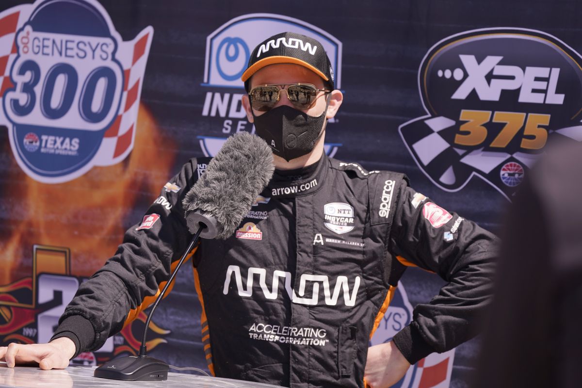 Pato O'Ward of Mexico speaks to reporters after driving during IndyCar auto race testing at Texas Motor Speedway in Fort Worth, Texas, Wednesday, March 31, 2021.  (Associated Press)
