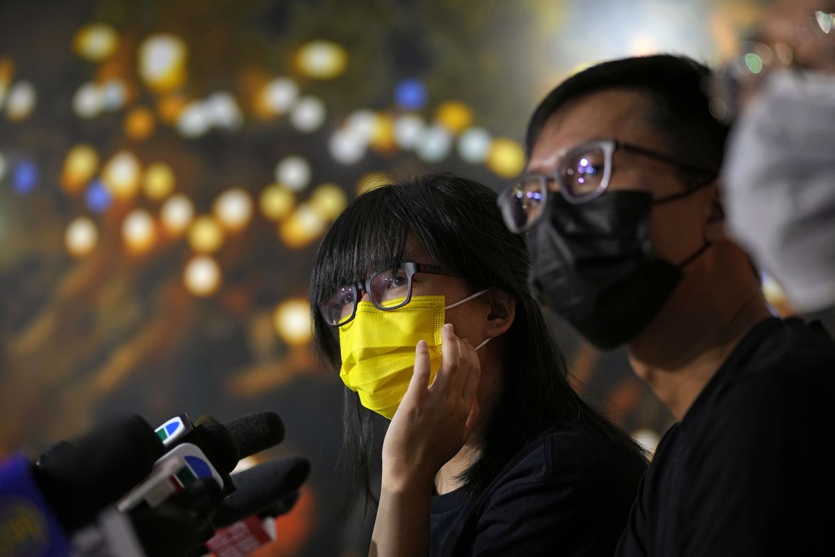 Chow Han Tung, left, vice chairwoman of the Hong Kong Alliance in Support of Patriotic Democratic Movements of China, and other group members attend a news conference in Hong Kong, Sunday, Sept. 5, 2021. The group behind the annual Tiananmen Square memorial vigil in Hong Kong said Sunday it will not cooperate with police conducting a national security investigation into the group