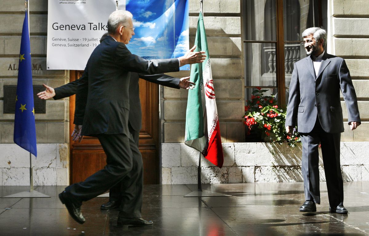 European Union foreign policy chief Javier Solana, background, and a protocol official greet Iran’s negotiator, Saeed Jalili, right, before a meeting in Geneva, Switzerland, on Saturday. Associated Press photos (Associated Press photos / The Spokesman-Review)