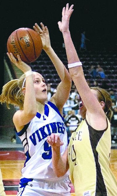
CdA senior Dayna Drager shoots over Vallivue's Samantha Patterson in their 5A semifinal Friday. 
 (Matt Cilley Special to / The Spokesman-Review)