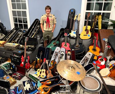 Brendan Wheeler, a Langley High School 14-year-old from Great Falls, Va., repaired more than 100 instruments from folks around the D.C.-area, as part of this Eagle Scout service project.  (Courtesy of Megan Kenna)