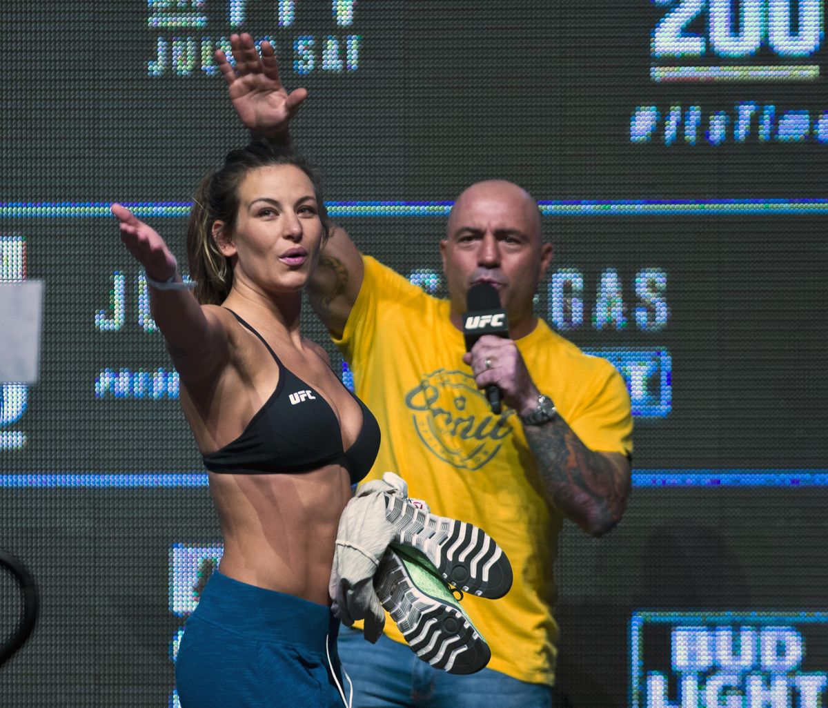 Miesha Tate salutes the fans after an interview with Joe Rogan during the UFC 200 weigh-ins in Las Vegas on Friday. (L.E. Baskow / Associated Press)