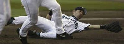 
Catches such as this one earned Seattle Mariners right fielder Ichiro Suzuki his fourth consecutive American League Gold Glove on Tuesday.
 (Associated Press / The Spokesman-Review)