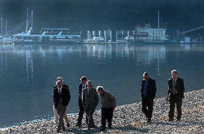 
Attorneys and Judge James Judd, fourth from left, walk down Sanders Beach and look at the disputed water line area Friday afternoon. 
 (Jesse Tinsley / The Spokesman-Review)