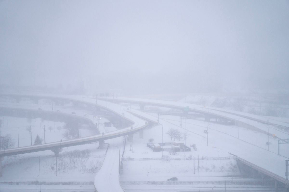 Commuters try to navigate I-94 as snow falls as part of Winter Storm Olive Thursday, Feb. 23, 2023, in Minneapolis, Minnesota.    (Alex Kormann/Minneapolis Star Tribune/TNS)