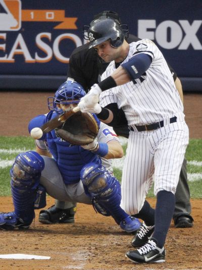  Yankees' Nick Swisher hits a solo home run off Rangers starting pitcher C.J. Wilson in the third inning.  (Associated Press)