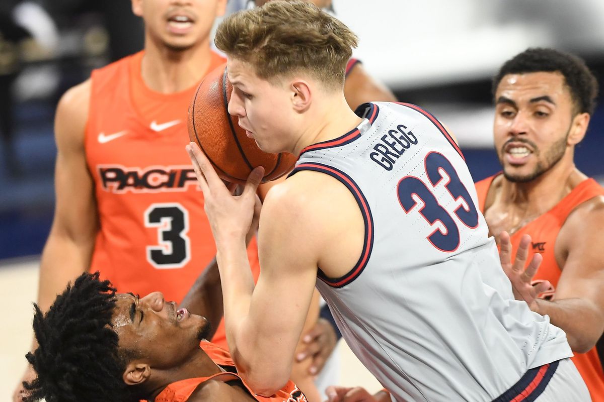 Gonzaga Bulldogs forward Ben Gregg (33) collides with Pacific Tigers guard Jalen Brown (2) during the second half of a college basketball game on Saturday, January 23, 2021, at McCarthey Athletic Center in Spokane, Wash.  (Tyler Tjomsland / The Spokesman-Review)