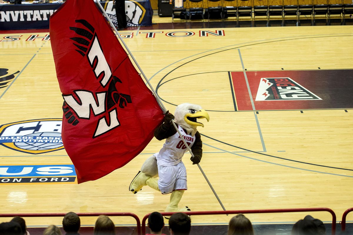 Swoop, the EWU mascot, runs the Eastern flag around the court just as the Eagles take the court, Wed., March 16, 2016, on Reese Court in Cheney. (Colin Mulvany / The Spokesman-Review)
