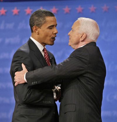 Obama and McCain share a light moment before their debate at Hofstra University.   (Associated Press / The Spokesman-Review)