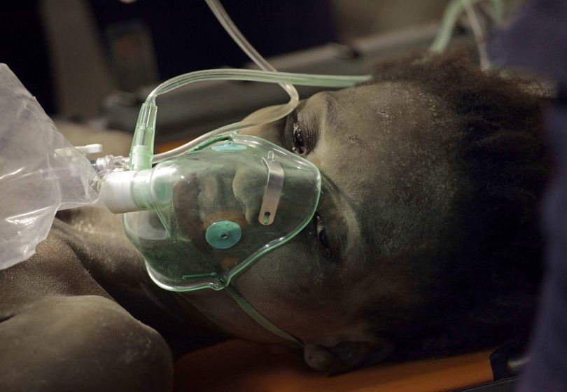 Darlene Etienne, 17, rests at a French military field hospital after being rescued from a building  in Port-au-Prince, Wednesday, Jan. 27, 2010. French rescuers pulled the teenage girl out of the rubble 15 days after an earthquake hit the Caribbean capital. (Ramon Espinosa / Associated Press)