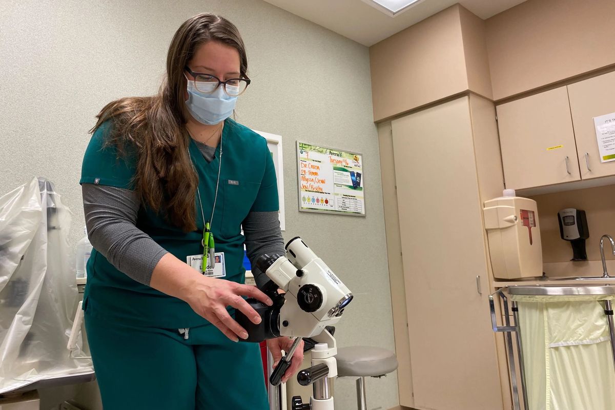 Lindee Miller, a nurse at Avera St. Mary’s Hospital in Pierre, South Dakota, turns on the camera attached to a colposcope, a magnifying device used to closely examine the vagina and cervix. The camera transmits a live view of the exam to the remote sexual assault nurse examiner. (Arielle Zionts/KHN/TNS) (ARIELLE ZIONTS/KHN/TNS)
