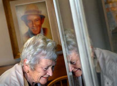 
Joan Northcott, of Cornwall, England, examines Bing Crosby artifacts Friday at Gonzaga University. 
 (Brian Plonka / The Spokesman-Review)