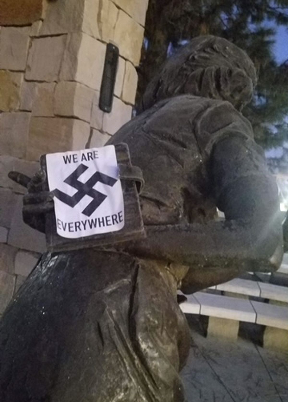 In this photo provided by the Wassmuth Center for Human Rights, a swastika sticker is seen on a sculpture at the Idaho Anne Frank Human Rights Memorial in Boise, Idaho on Tuesday, Dec. 8, 2020. Boise police are investigating after the memorial was defaced by swastika stickers earlier this week. The stickers, which included the words, "we are everywhere" as well as the Nazi insignia, were discovered Tuesday morning by a visitor to the memorial in downtown Boise.  (HONS)