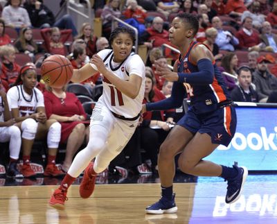 Louisville guard Arica Carter attempts to drive past the defense of Virginia guard Dominique Toussaint on Thursday, Jan 17, 2019, in Louisville, Ky., Louisville won 91-43. (Timothy D. Easley / Associated Press)
