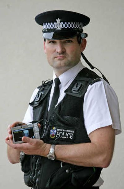 
Sergeant Olly Tayler from Devon and Cornwall Police poses with a bodyworn video system at the national launch in Plymouth, Devon, Thursday.
 (Associated Press / The Spokesman-Review)
