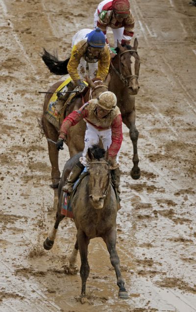 Joel Rosario rides Orb, winning the 139th Kentucky Derby at Churchill Downs Saturday, May 4, 2013, in Louisville, Ky. (Charlie Riedel / Associated Press)