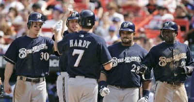 
J.J. Hardy has helped infuse the Milwaukee Brewers with a winning spirit, as acknowledged by teammates Craig Counsell, Gabe Gross, Prince Fielder and Tony Gwynn Jr., left to right. 
 (Associated Press / The Spokesman-Review)