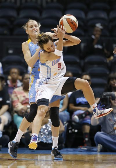 Atlanta Dream guard Celine Dumerc, front, attempts to receive a pass as Chicago Sky guard Allie Quigley defends. (Associated Press)