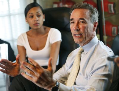 FILE - In this May 21, 2015 file photo former delegate Joe Morrissey, right, speaks as the mother of his son, Myrna Warren listens during a news conference at his office in Highland Springs, Va. A new poll shows the flamboyant former Virginia lawmaker who pleaded guilty to a misdemeanor in a sex scandal involving a then 17-year-old Warren is the current front-runner in the race to be Richmond's next mayor. (Steve Helber / AP)
