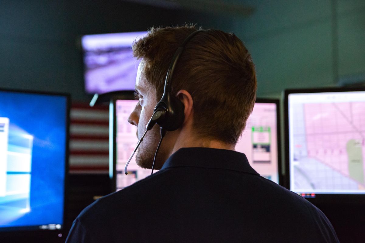 Chris Drohan, fire communications officer, works in the fire dispatch area at the new Spokane Regional Emergency Center (SREC), on Thursday, July 18, 2019 at 1620 N. Rebecca Street in Spokane, WA. Last year, 553,495 calls were received between 911, Crime Check, law enforcement, fire and medical response agencies. (Libby Kamrowski / The Spokesman-Review)