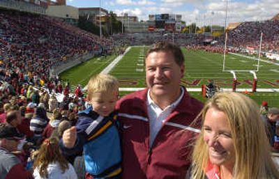 Former Cougars lineman Jamie White attends WSU's homecoming game with his son, James, and wife, Holley, last Saturday in Pullman.
(Christopher Anderson / The Spokesman-Review)