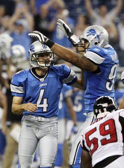 Jason Hanson (4) is congratulated after his game-winning field goal during a preseason game against the Atlanta Falcons. (Associated Press / The Spokesman-Review)