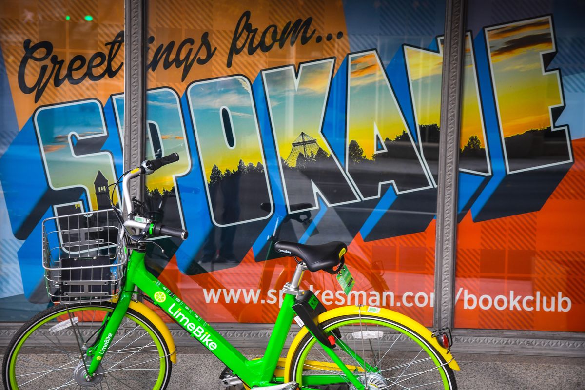 A non-electric Lime bike finds a a stop to rest at the corner of Sprague and Monroe, Monday, Oct. 29, 2018, in Spokane, Wash. (Dan Pelle / The Spokesman-Review)
