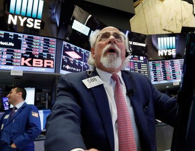 In this AP file photo from May 17, trader Peter Tuchman works on the floor of the New York Stock Exchange during a stretch when stocks had fallen sharply. (AP Photo/Richard Drew)