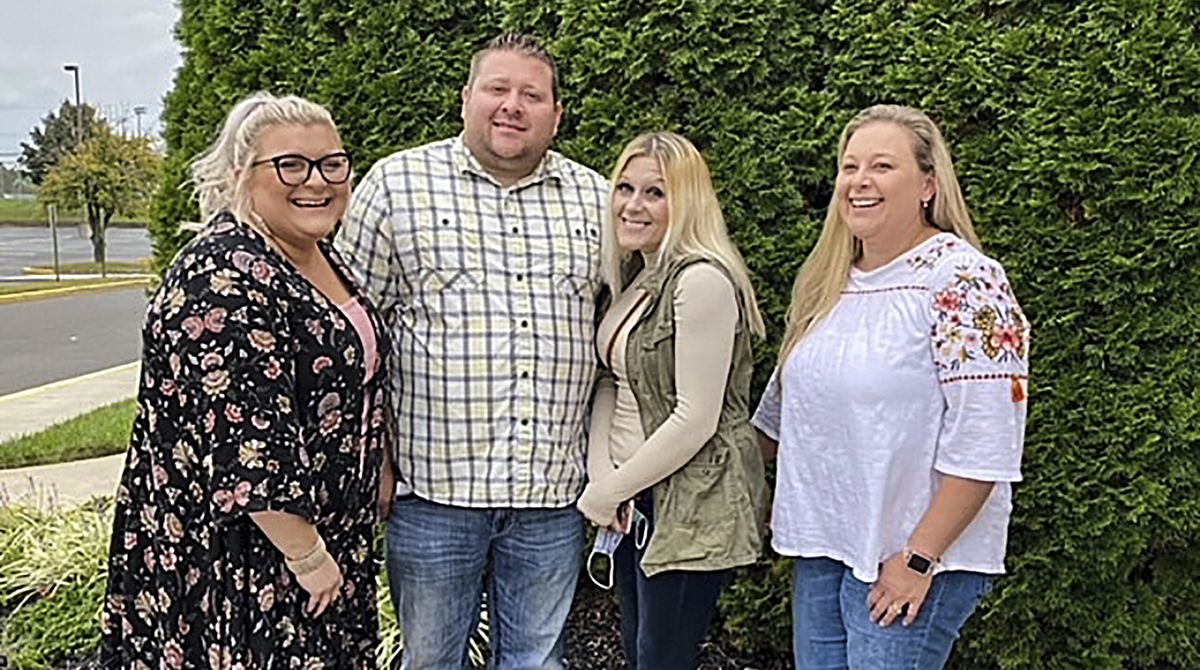 In this photo taken in October 2020, Jennifer Lannon, second from right, poses for a photo with her brother Chris Whitman, second from left, and sisters, Sarah Whitman, far left, and Kim Bermudez in Blackwood, N.J. Lannon