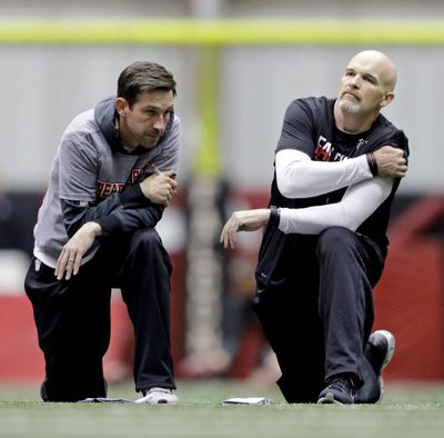Then Atlanta-coach Dan Quinn, right, talks with offensive coordinator Kyle Shanahan when the two were with the Falcons in 2017.  (Associated Press)