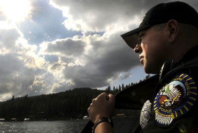 Coeur d’Alene tribal marine patrol officer John Dressler surveys Lake Coeur d’Alene. He was the victim of an alleged assault over the summer.  (Kathy Plonka / The Spokesman-Review)