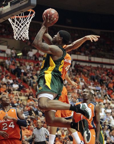 Baylor’s Kevin Rogers  goes up against Auburn’s Lucas Hargrove during Tuesday’s quarterfinal. (Associated Press / The Spokesman-Review)