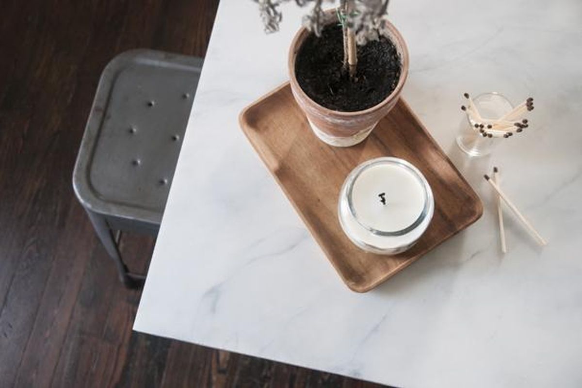 Blogger and designer Erin Souder redid her kitchen counter for $30 by painting a slab of butcher block she had in her garage. Her "very discerning" mother-in-law thought it was real marble. "It