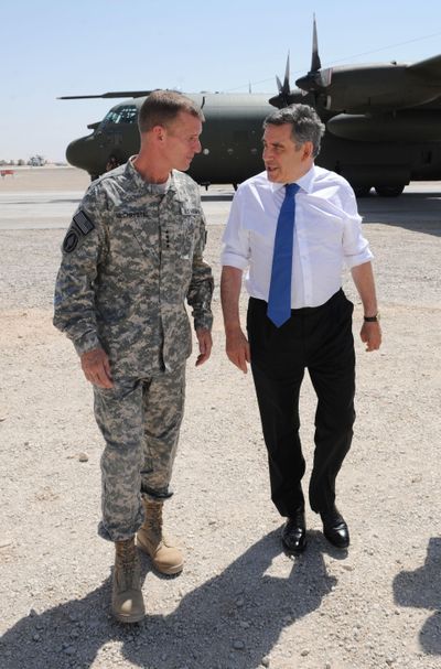 Britain’s Prime Minister Gordon Brown, right, is greeted by Gen. Stanley McChrystal, the head of U.S. and NATO forces in Afghanistan, on Saturday at Camp Bastion in Afghanistan.  (Associated Press / The Spokesman-Review)