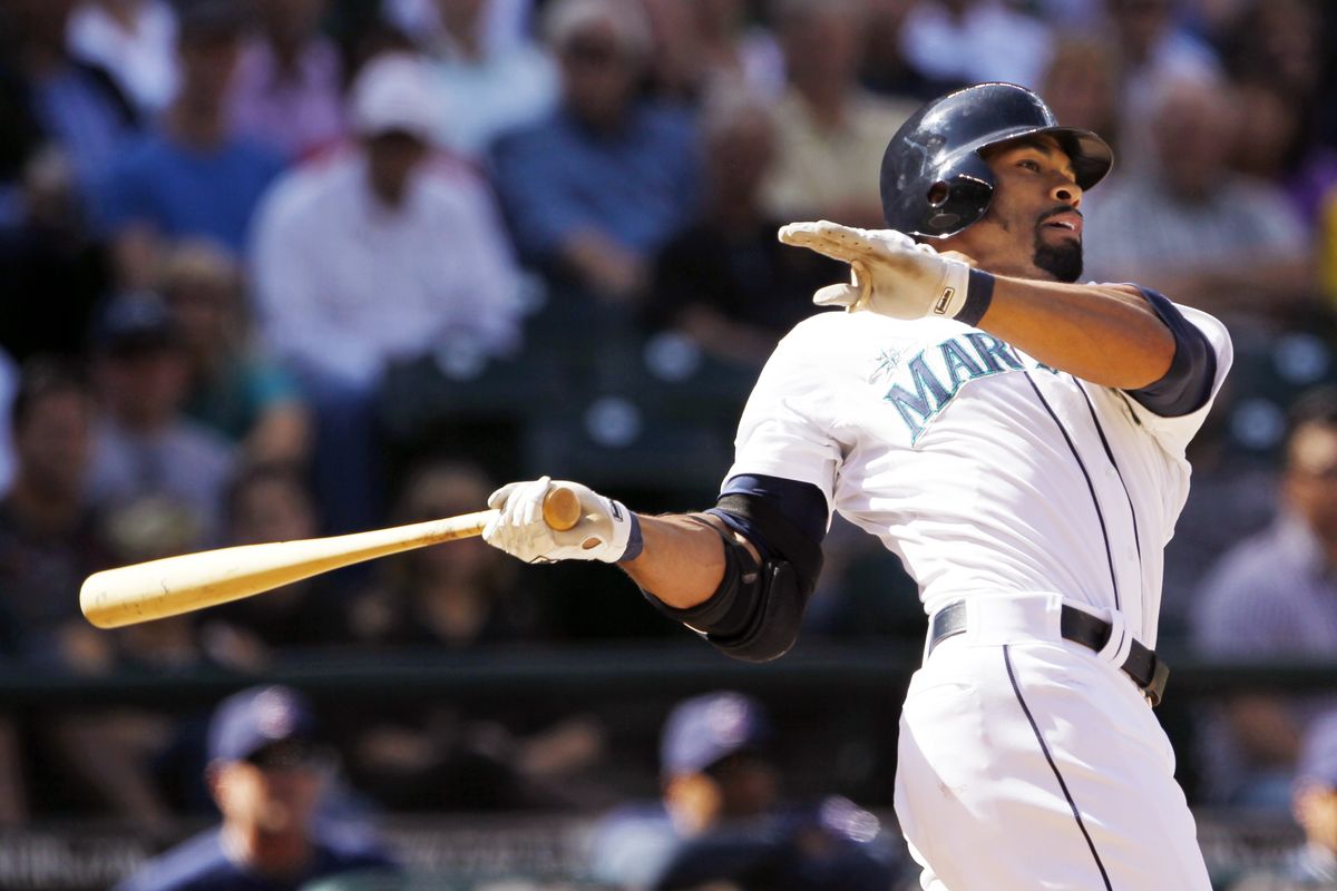 Seattle’s Eric Thames hits a tiebreaking two- run double in the bottom of the eighth inning of the M’s 3-1 win on Wednesday. (Associated Press)