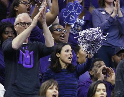 Actress Julia Louis-Dreyfus, center, watches her team Northwestern play against Gonzaga during the first half of a second-round college basketball game in the men's NCAA Tournament, Saturday, March 18, 2017, in Salt Lake City. (George Frey / Associated Press)