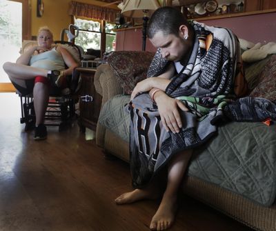 In this Monday, July 29, 2019 photo, Dylan Nelson, of Burlington, Wis., and his sister, Andrea, sit for an interview. He was rushed to the hospital in June by his sister with severe breathing problems. Doctors believe he and about two dozen other young adults suffered serious lung injuries after vaping nicotine or THC, or both. (Rick Wood / AP)